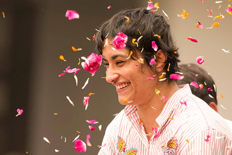 Wrestler Vinesh Phogat being welcomed on her arrival at IGI airport